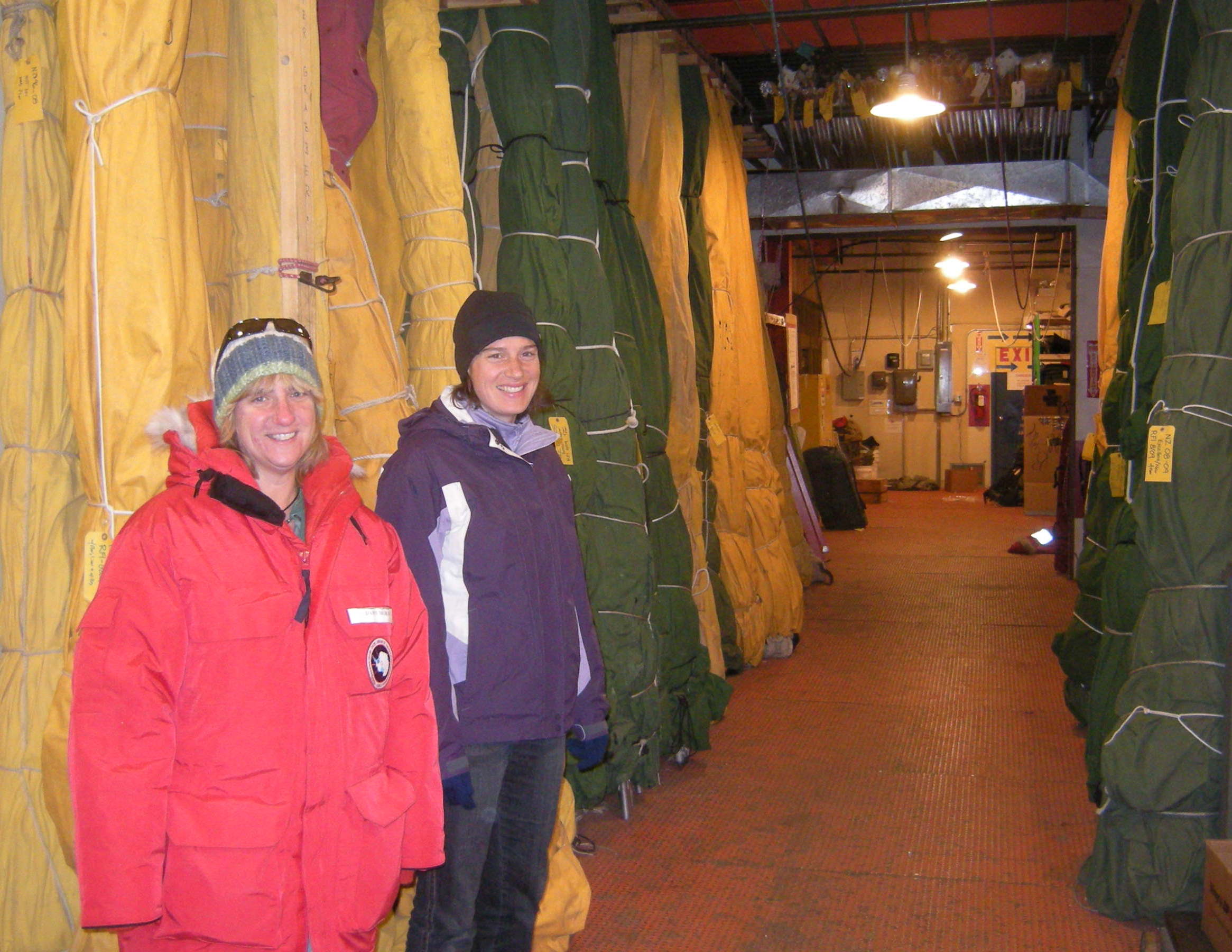 Dawn and Abigail check out the row of Scott tents available for check-out at the Berg Field Center